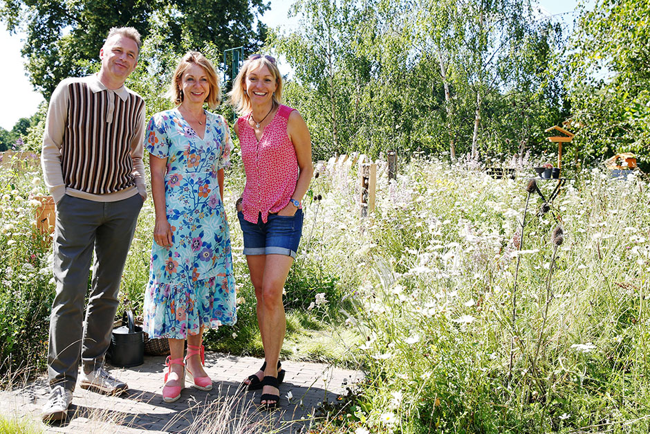 Presenters Chris Packham (L) and Micheala Strachan (R) pose with garden designer Jo Thompson on the BBC Springwatch Garden