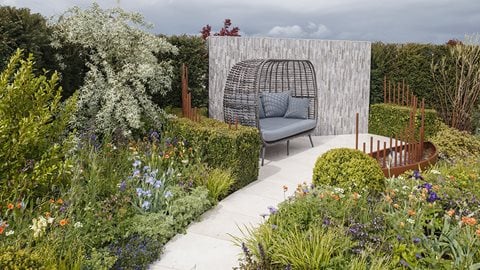 A considered and richly planted garden, making careful use of foliage and flower colour. Designed to evoke the journey taken by a diabetes patient