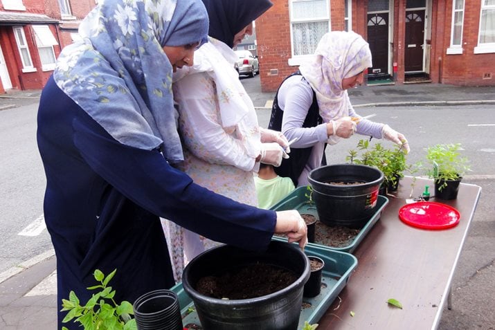 Cheetham Hill residents planting for their tea garden