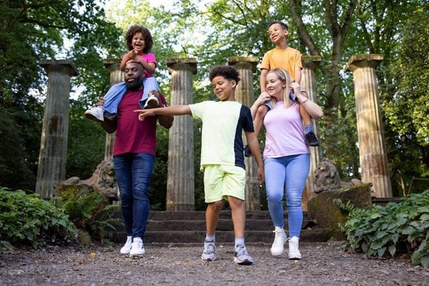 Photo of a family on a summer day walking through RHS Hude Hall