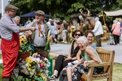 Visitors having fun at a show with entertainers
