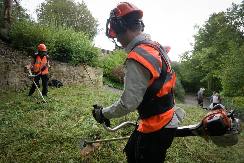 A hard hat, ear defenders and face visor protect from noise and the objects flicked up by a strimmer.