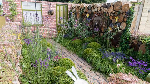 Planting in this garden is impressively varied, and differently sized box balls (resembling the segments of the eponymous caterpillar) provide evergreen structure