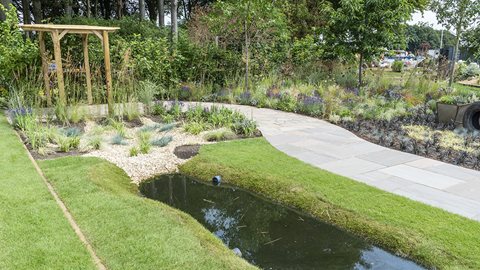 A garden that represents the amalgamation of farming practice with the natural environment by planting rows of ‘crops’ at the front, gradually giving way to natural planting.
