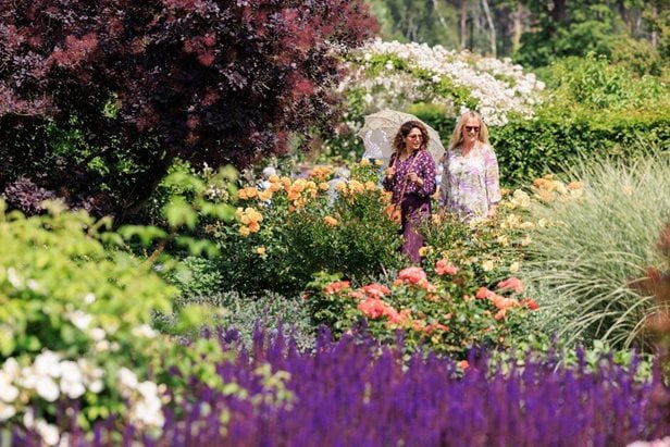 Photo of two women enjoying an RHS garden