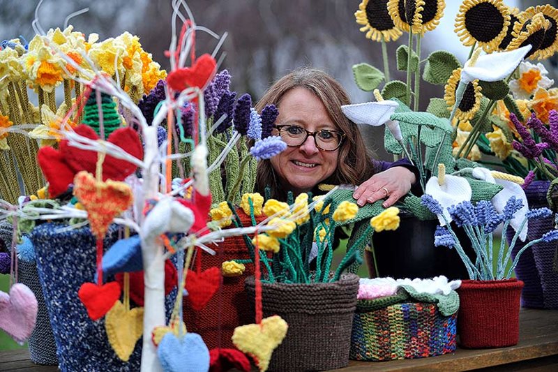 Clare Young with knitted flowers