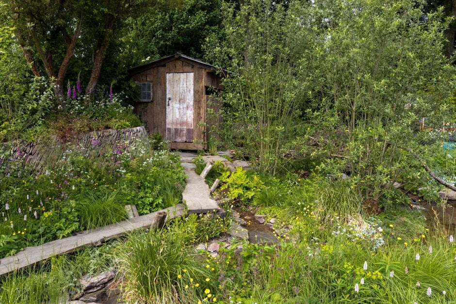 Garden designers, Adam Hunt and Lulu Urquhart pose for photos on their "A Rewilding Britain Landscape" show garden