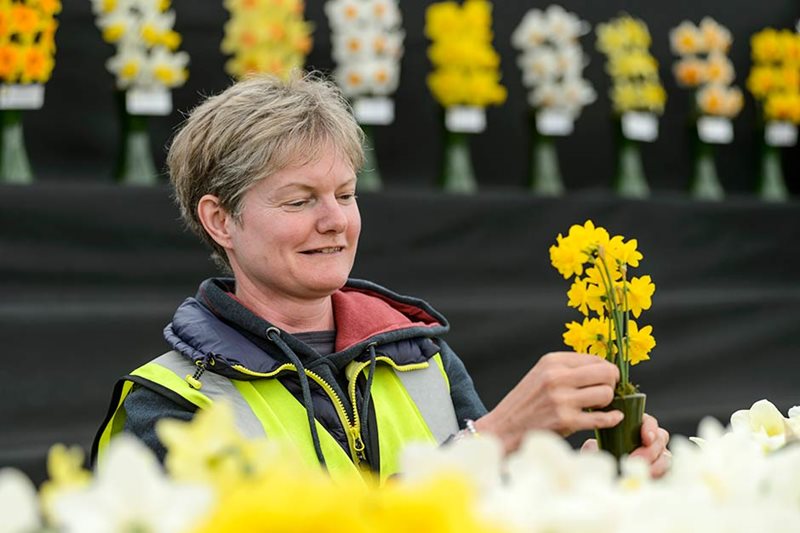 Sharron Scamp putting finishing touches to a flower display