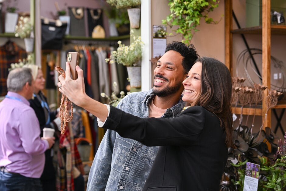 Ashley Edwards and visitor taking selfie