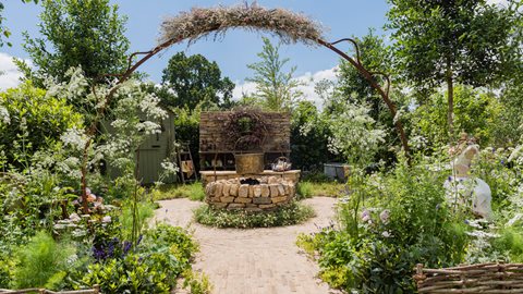 This creative sanctuary is the imagined garden of a 'green witch', filled with both beautiful and productive planting and linked by the repeated use of circles, which reference the cycles of nature
