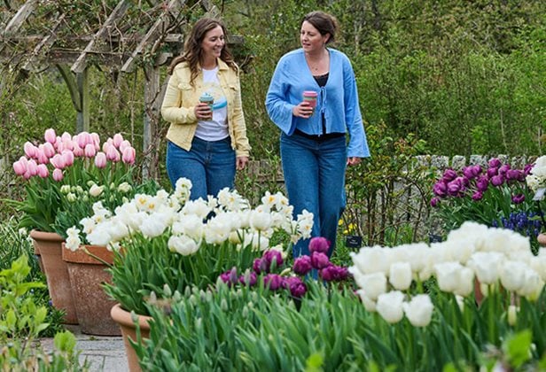 Photo of two women enjoying an RHS garden