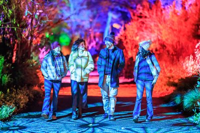 Friends enjoying RHS Glow illuminations