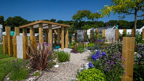 This beautiful garden for a coastal location has generous colourful planting and a relaxed feel. It's the perfect spot to unwind