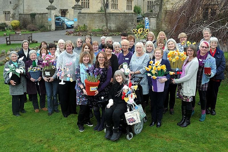 volunteer knitters with their knitted flowers