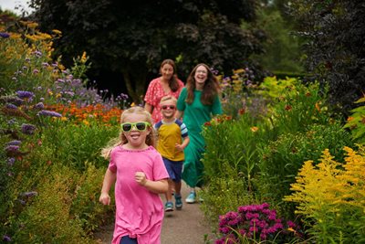 Family enjoying exploring RHS Rosemoor’s Hot Garden in summer