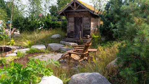 A garden showing an example of how Scandinavians use their plots of land as a place to relax and enjoy their natural surroundings.