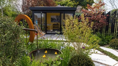 Recycled and reclaimed materials are the stars of this modern urban garden where sustainability doesn’t mean sacrificing clean sharp lines and lush planting