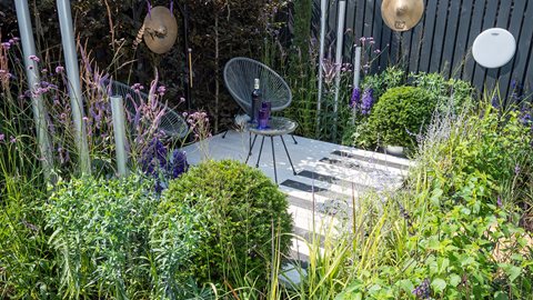 Serried rows of plants help build the concept of a musical crescendo, leading the visitor to a deck so they can sit back and relax