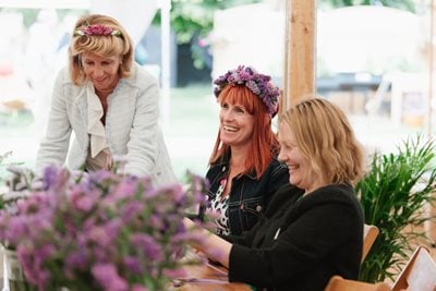 Women making flower crowns