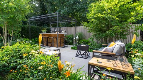 Designed for a young couple, the Landform Bar Garden, with its calming colour palette and luscious foliage, is intended as a space for entertaining and relaxing.