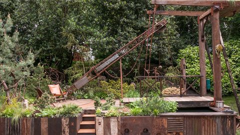 A garden that features a derelict industrial wharf at its heart, extensive use is made of recycled materials while calming understated planting creates a sense of wellbeing.