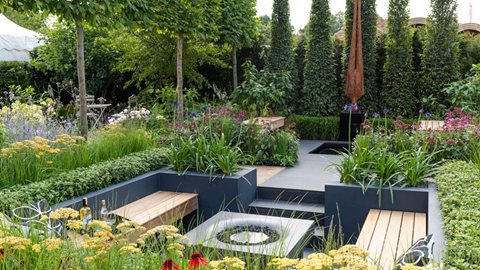 Two distinct garden styles make up this garden which has been designed for a couple with very different tastes. One half is a cottage-style garden and the other is a chic contemporary design