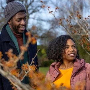 Couple enjoying a winter walk in an RHS garden 