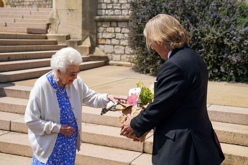 Keith Weed, RHS President presenting HM The Queen with a rose