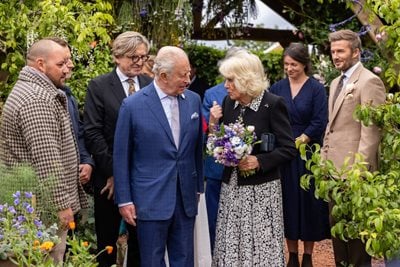 The King and Queen deep in discussion on the RHS Feature Garden at RHS Chelsea 2026