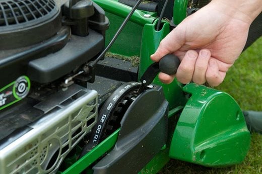 adjusting the lawn mower cut height