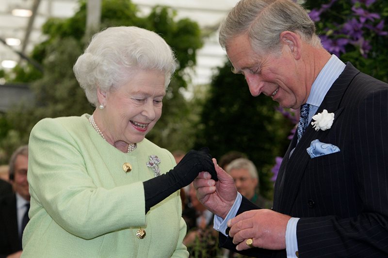 The Queen presenting the Prince of Wales with the RHS Victoria Medal of Honour