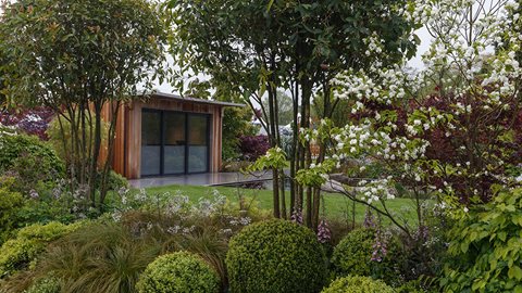 Large and sumptuous garden designed to evoke a calming, contemplative feel, featuring impressive planting of a range of perennials and semi-mature shrubs