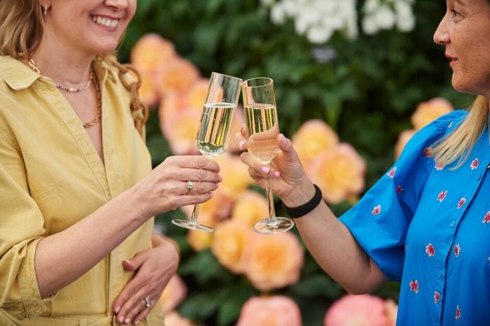 Friends enjoy champagne at RHS Chelsea Flower Show