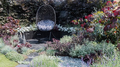 Brooding black, red and purple planting is shot through with silver and grey in this garden dedicated to improving mental health