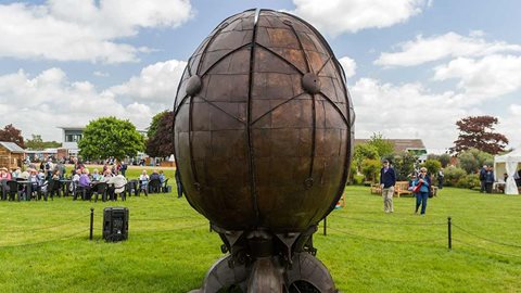 Every half an hour the 'egg' opens and closes, revealing constantly different views of the colourful planting inside