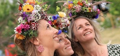 Three ladies wearing flower crowns