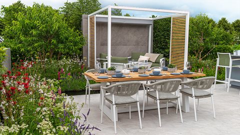 A contemporary and stylish garden with outdoor speakers hidden in the borders, and lighting, so the garden can be used for entertainment well into the night