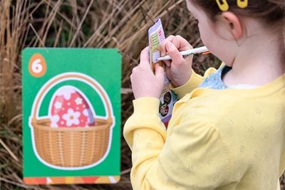 Young girl finding easter eggs on our egg hunt