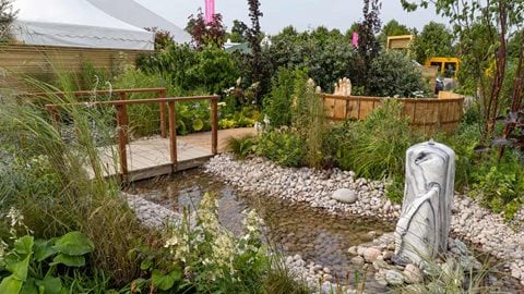 Lots of plants with blue flowers provide a sense of cool and calm, while yellow flowers inject a feel of positivity. Many of the plants are upright or upward pointing, reinforcing the overall feeling.